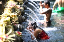 Girl baths in the temple, Bali, by marcorossimusic