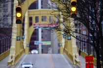 Yellow traffic lights above the bridge, Pittsburgh, by marcorossimusic
