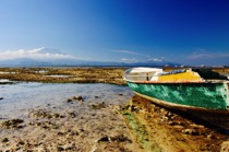 Boat with very low tide, Bali, by marcorossimusic