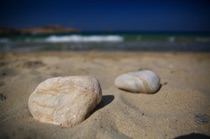 Stones and sand, Paros, Greece, by marcorossimusic